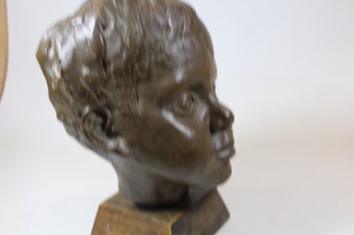 Lot 17 - A 20th century bronzed portrait bust of a boy,...