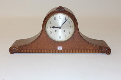 Lot 20 - A 1930s oak cased eight day mantel clock, the...
