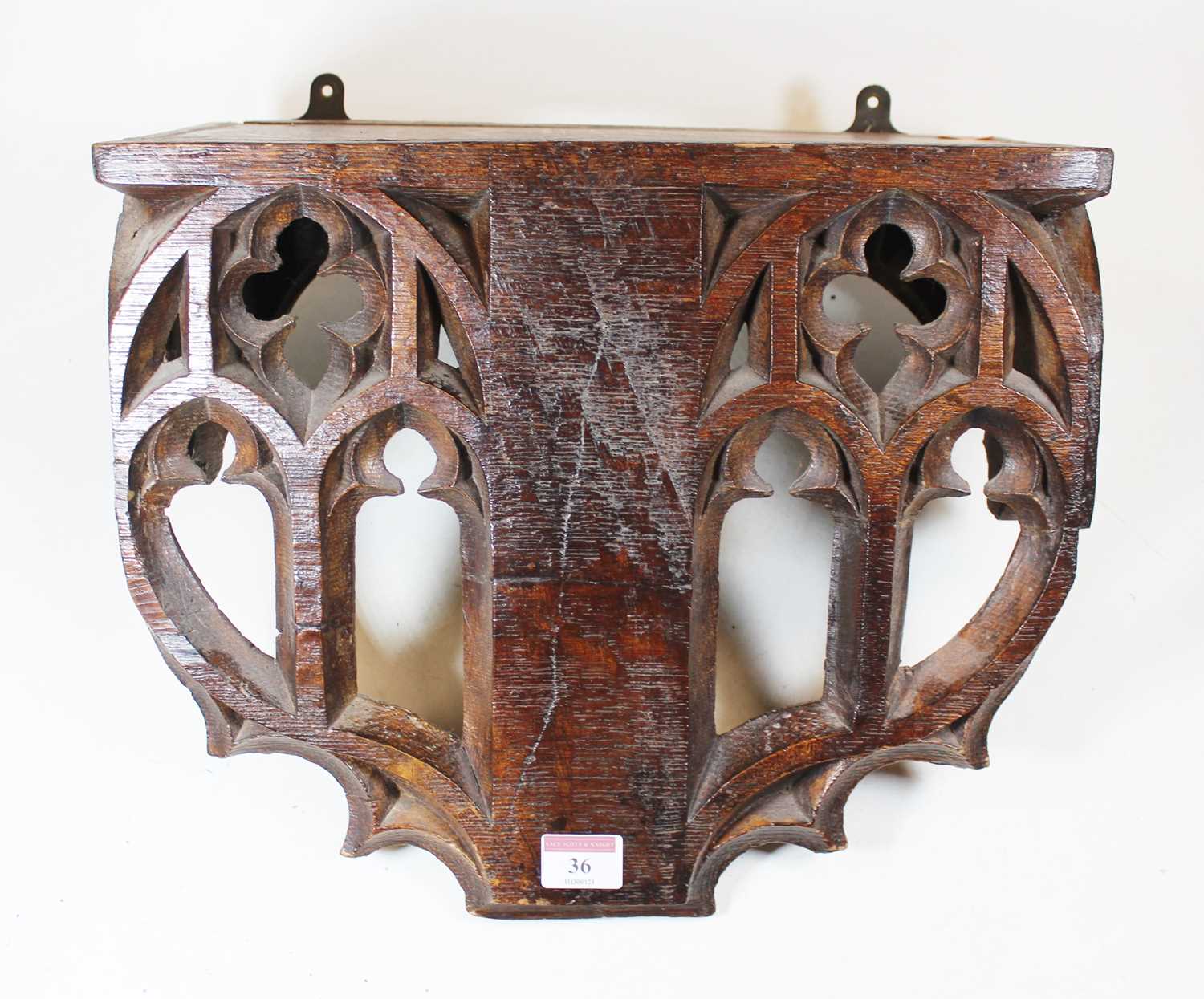 Lot 36 - A Victorian carved oak wall bracket, the apron...