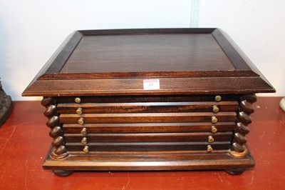 Lot 45 - A 20th century stained beech coin collector's...