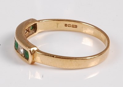 Lot 2552 - An 18ct yellow gold, emerald and diamond seven...