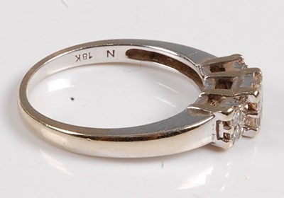 Lot 2562 - A white metal diamond dress ring, comprising...