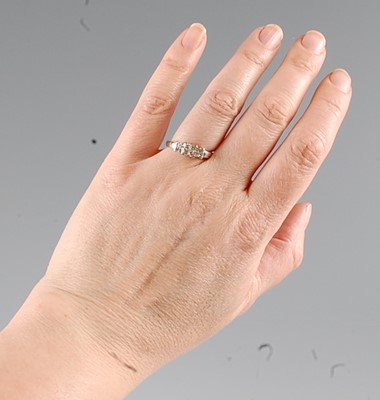 Lot 2562 - A white metal diamond dress ring, comprising...