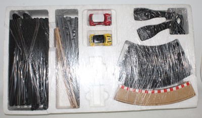 Lot 805 - Scalextric Mini Racing set, has been open but...