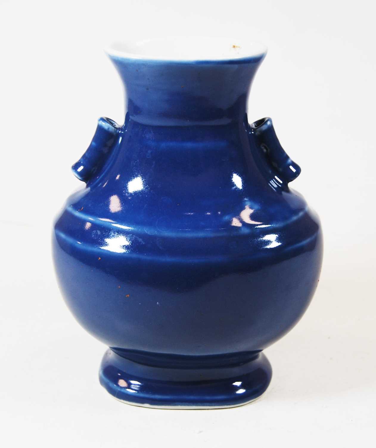Lot 79 - A Chinese export blue glazed vase of hu form,...