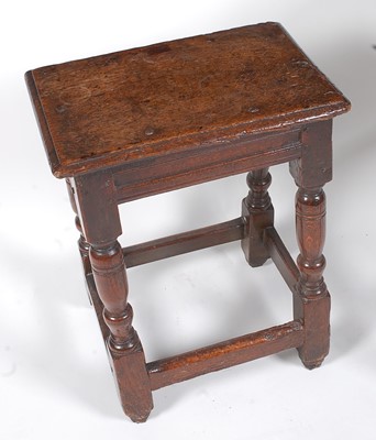 Lot 1423 - An 18th century oak joint stool, the top...