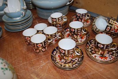 Lot 110 - A set of eleven Royal Crown Derby coffee cans...