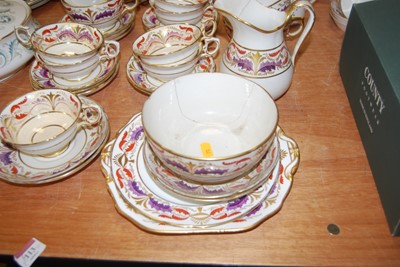 Lot 127 - A 19th century part dinner service, on a cream...