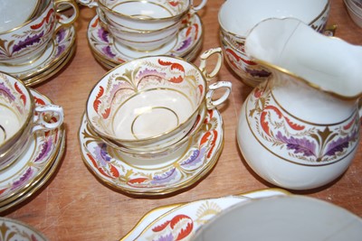 Lot 127 - A 19th century part dinner service, on a cream...