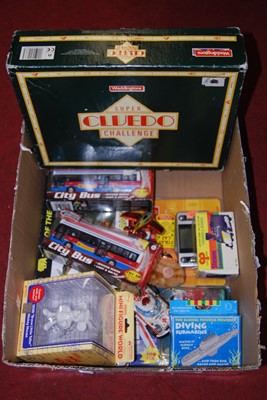 Lot 153 - A collection of toys and games, to include a...