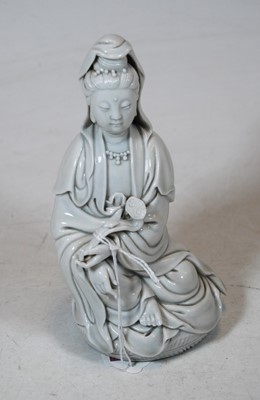 Lot 162 - A blanc-de-chine figure of Guanyin, in...