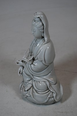 Lot 162 - A blanc-de-chine figure of Guanyin, in...