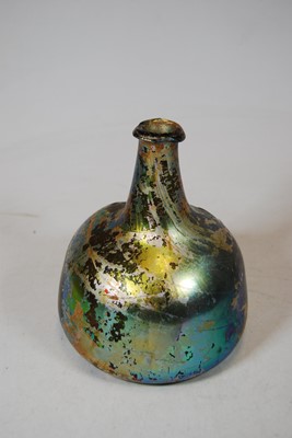 Lot 171 - A Roman iridescent glass bottle, of mallet...