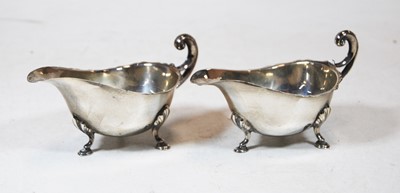 Lot 205 - A pair of George V silver sauceboats, of plain...