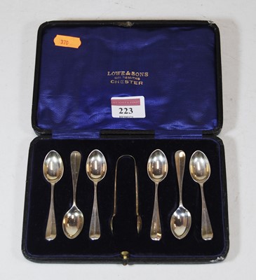 Lot 223 - A cased set of six coffee spoons with sugar tongs