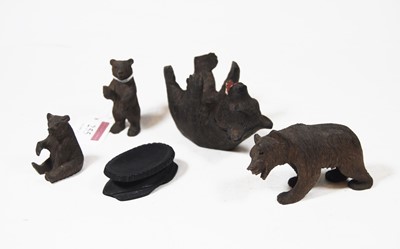 Lot 255 - A collection of four Black Forest style carved...