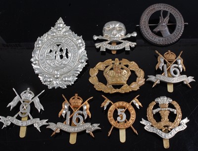 Lot 2222 - A collection of cap badges, buttons and...