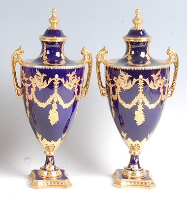 Lot 1064 - A pair of Lynton Porcelain Co pedestal vases...