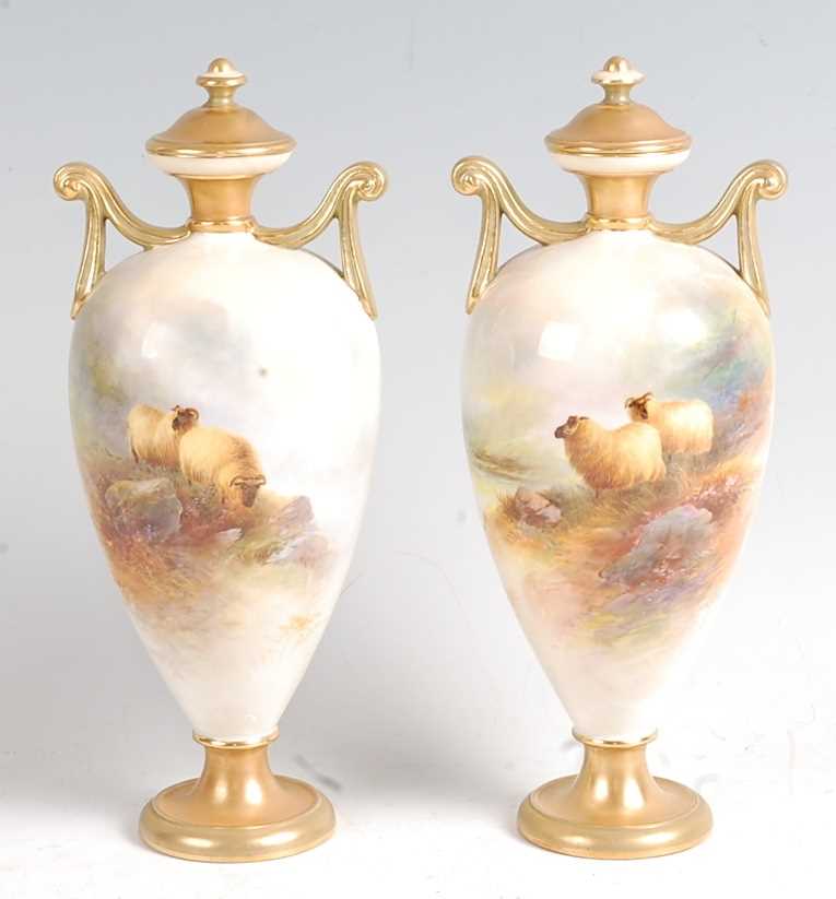 Lot 1015 - A pair of Royal Worcester porcelain pedestal...