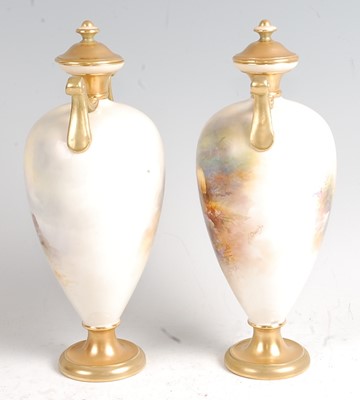 Lot 1015 - A pair of Royal Worcester porcelain pedestal...