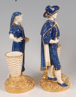Lot 1035 - A pair of Worcester porcelain figures of grape-...