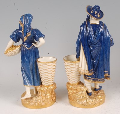 Lot 1035 - A pair of Worcester porcelain figures of grape-...