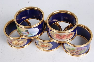 Lot 1091 - A set of five porcelain napkin rings, each...