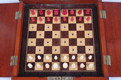 Lot 1263 - A circa 1900 mahogany travelling chess set,...