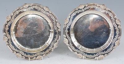 Lot 1097 - A set of eight silver plates, the broad rims...