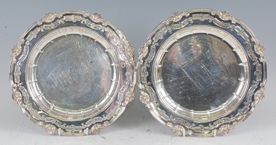 Lot 1097 - A set of eight silver plates, the broad rims...