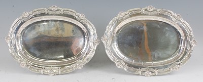 Lot 1099 - A pair of George V silver meat dishes, of oval...