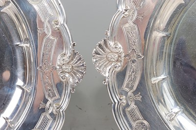 Lot 1099 - A pair of George V silver meat dishes, of oval...