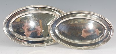 Lot 1103 - A graduated pair of Mappin & Webb silver meat...