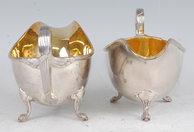 Lot 1100 - A pair of Mappin & Webb silver sauceboats,...