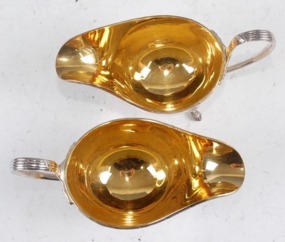 Lot 1100 - A pair of Mappin & Webb silver sauceboats,...