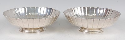 Lot 1101 - A pair of silver footed bowls, each of lobed...