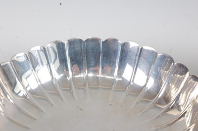 Lot 1101 - A pair of silver footed bowls, each of lobed...