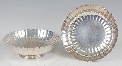 Lot 1101 - A pair of silver footed bowls, each of lobed...