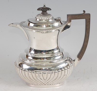 Lot 1119 - An Edwardian silver hot water pot, of...