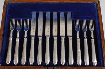 Lot 1125 - A cased 12-place setting of George V silver...