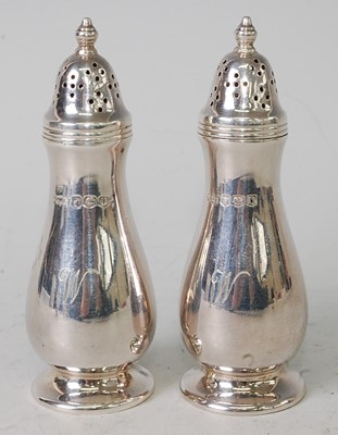 Lot 1105 - A pair of Mappin & Webb silver pepperettes,...