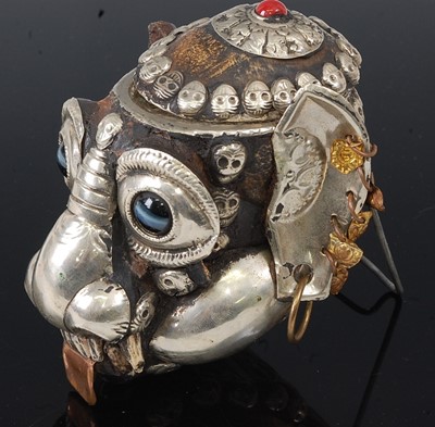 Lot 226 - * A Tibetan white metal mounted monkey skull...