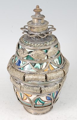 Lot 229 - * A 20th century Tibetan ritual jar and cover,...