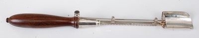 Lot 1140 - A Garrard & Co silver stilton scoop, with push...