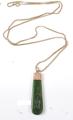 Lot 2564 - A yellow metal nephrite lozenge shaped pendant,...
