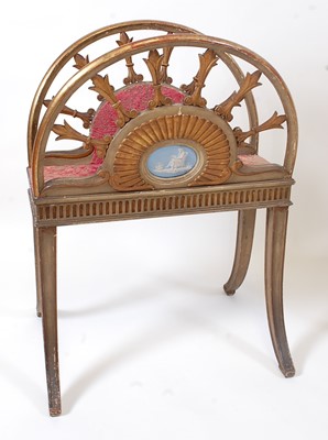 Lot 1475 - An Edwardian parcel gilt music canterbury, of...