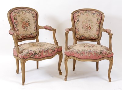 Lot 1394 - A pair of French giltwood fauteuil in the...