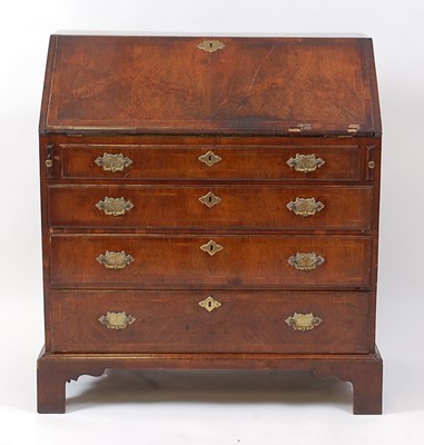 Lot 1466 - An early George III walnut writing bureau, the...