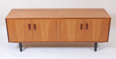 Lot 362 - A 1960s G-Plan teak four door low sideboard,...