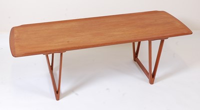 Lot 383 - A 1960s Danish teak long coffee table, having...